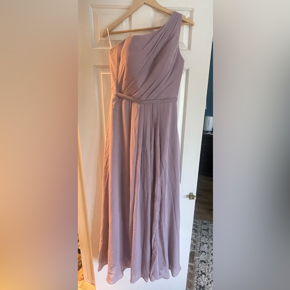 Stunning dress. Brand new. Never worn. Size 8 but fits like a 6.